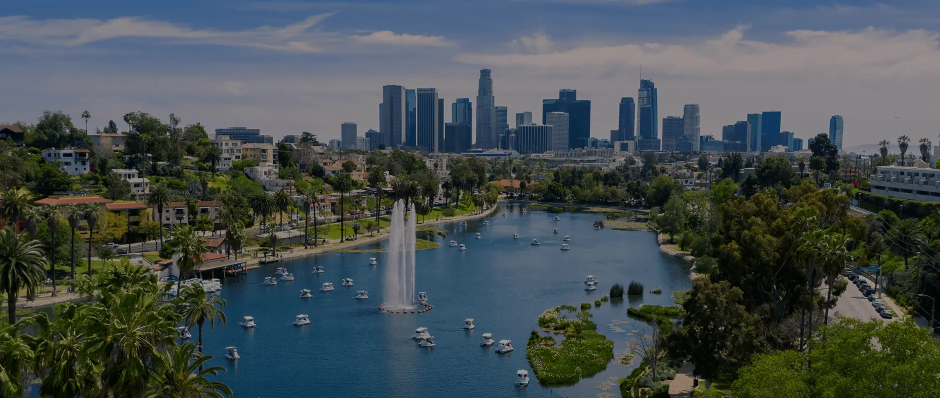 View of Los Angeles including boats on water in front of a fountain